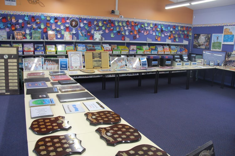 Library with old memorabilia set up on tables